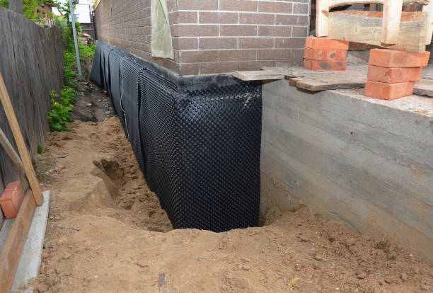 Happy homeowners after waterproofing job in Berryville